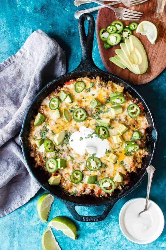 taco skillet on table with toppings