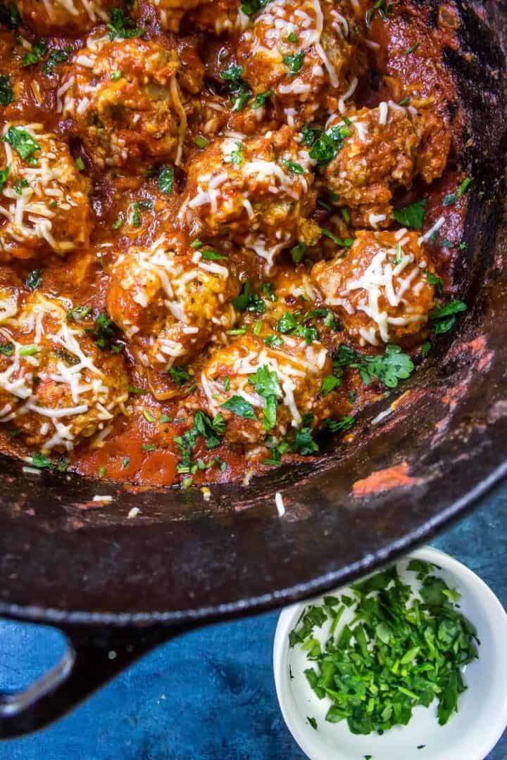 Keto Meatballs in a cast iron dutch oven with marinara sauce