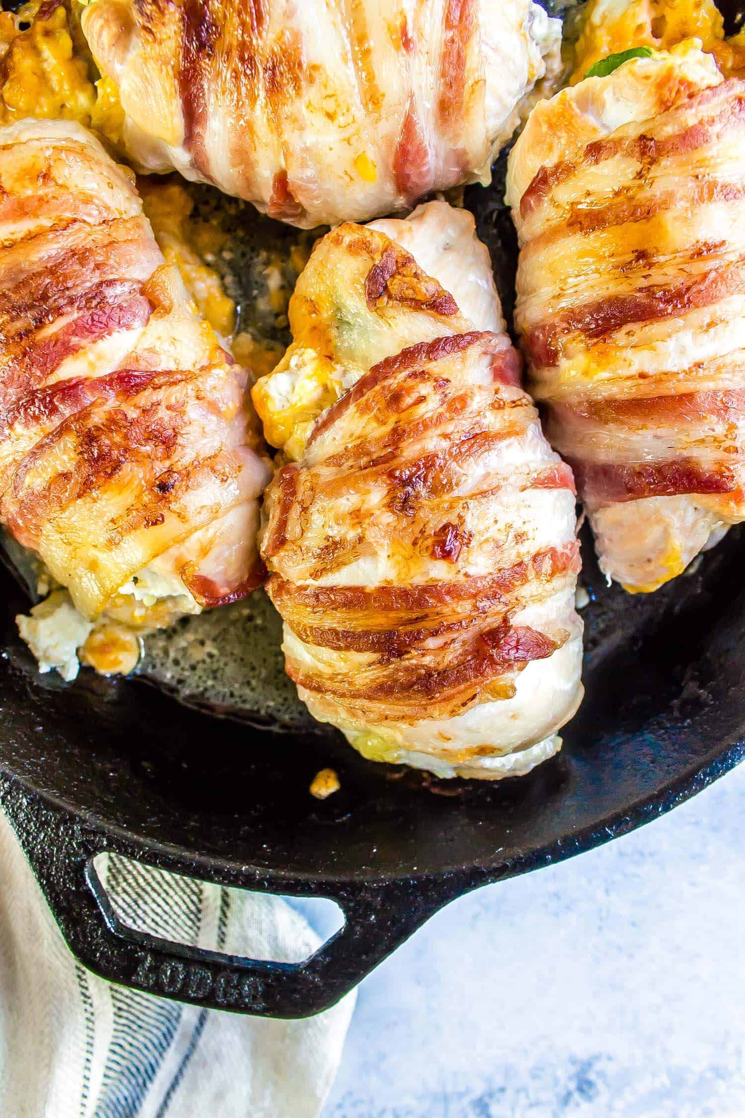 Jalapeno Popper Chicken in a cast iron skillet baked