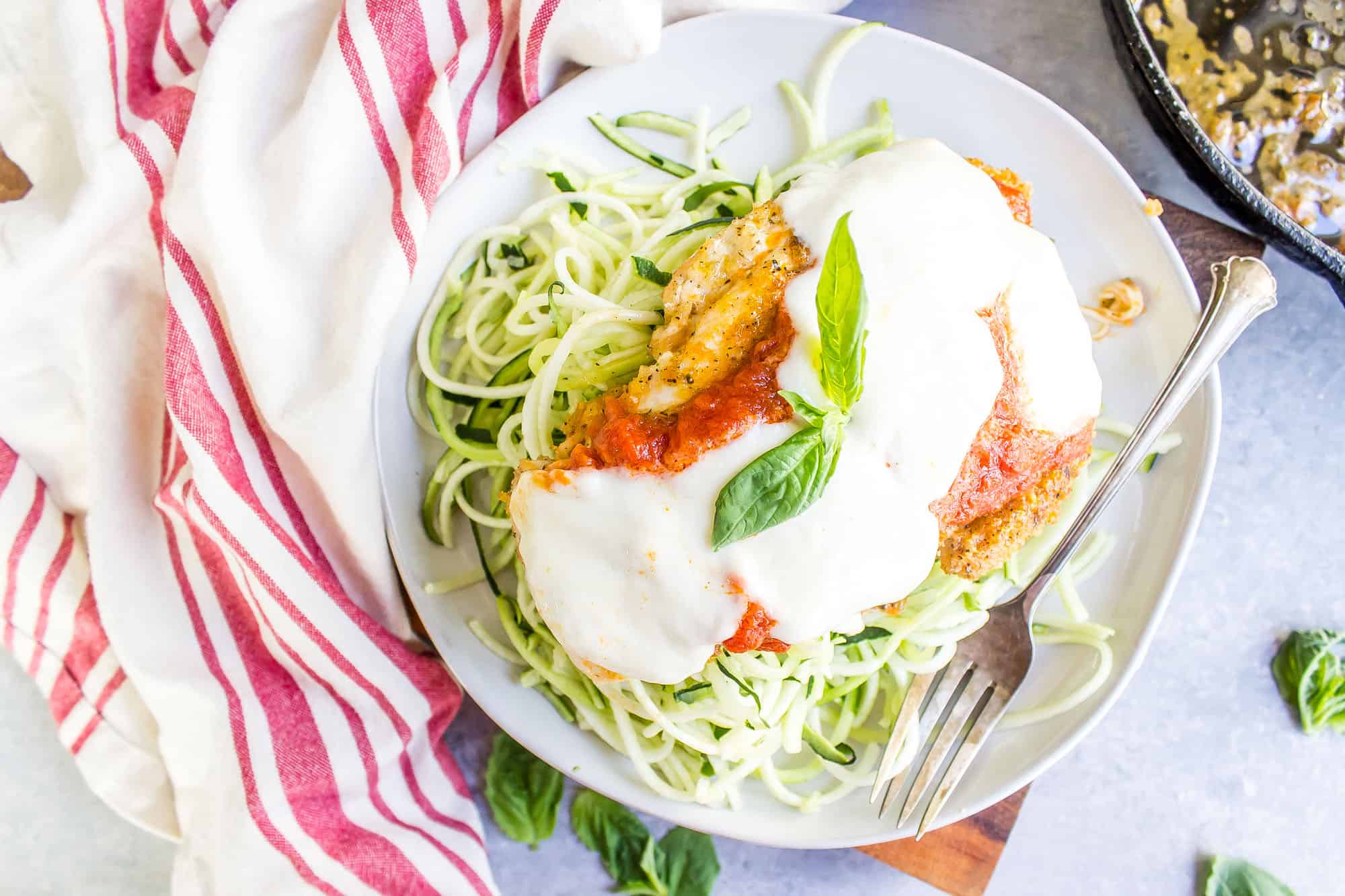 Keto Chicken Parmesan on a bed of zucchini noodles