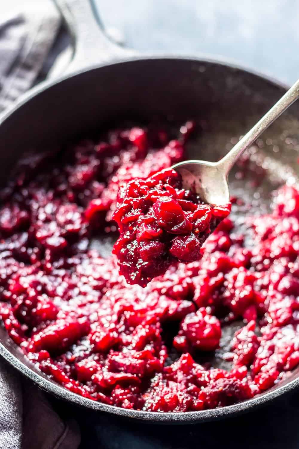 Keto Cranberry Sauce in skillet with spoon