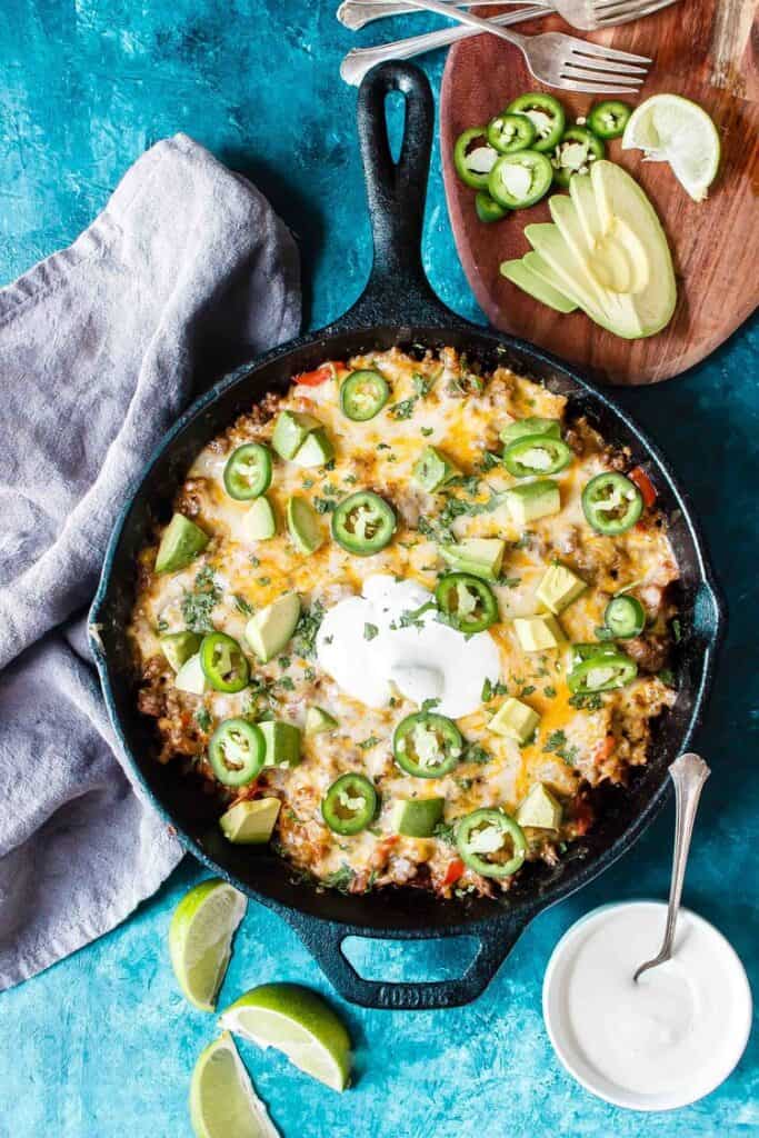 taco skillet on table with toppings