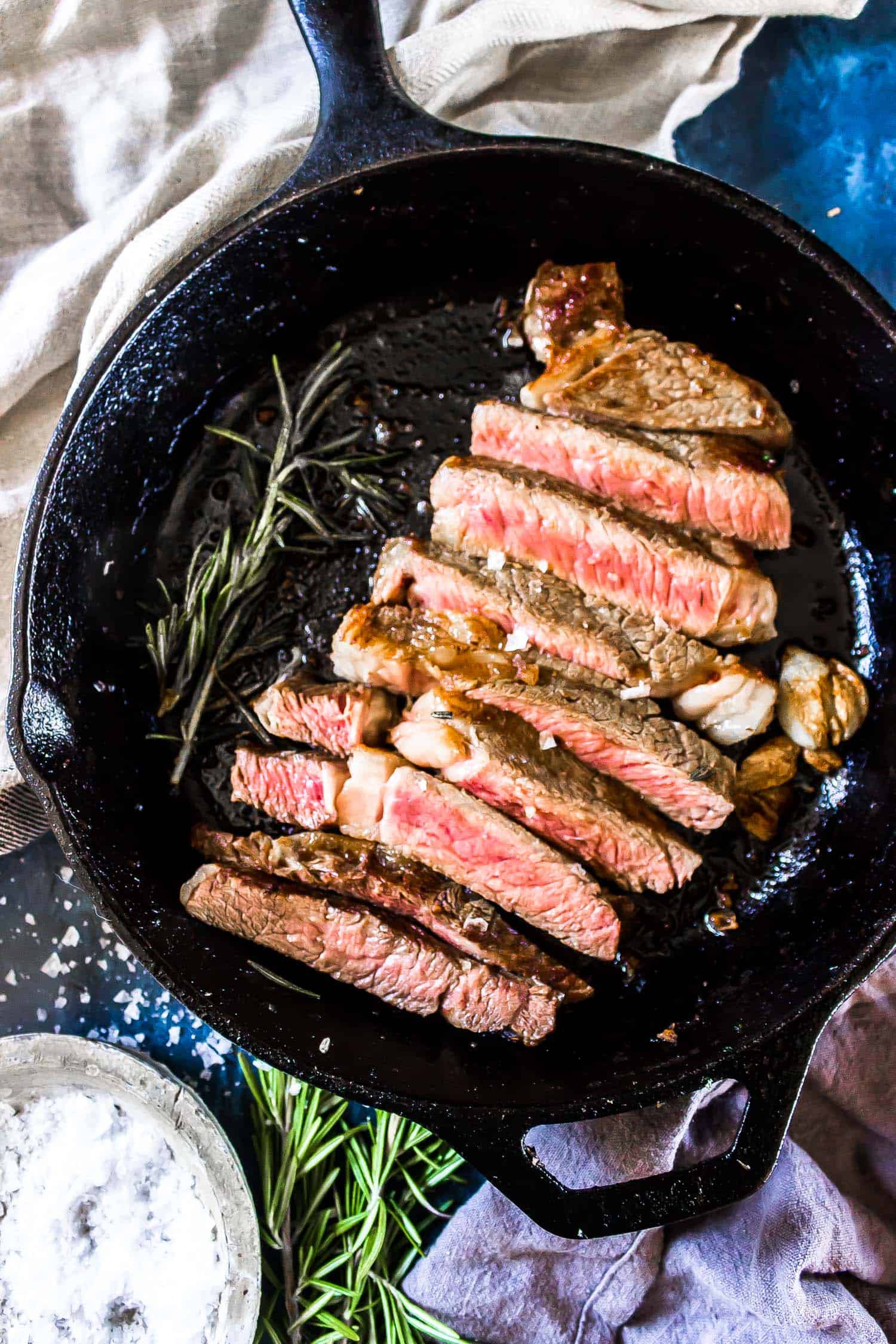 Cast Iron Steak sliced in a cast iron skillet
