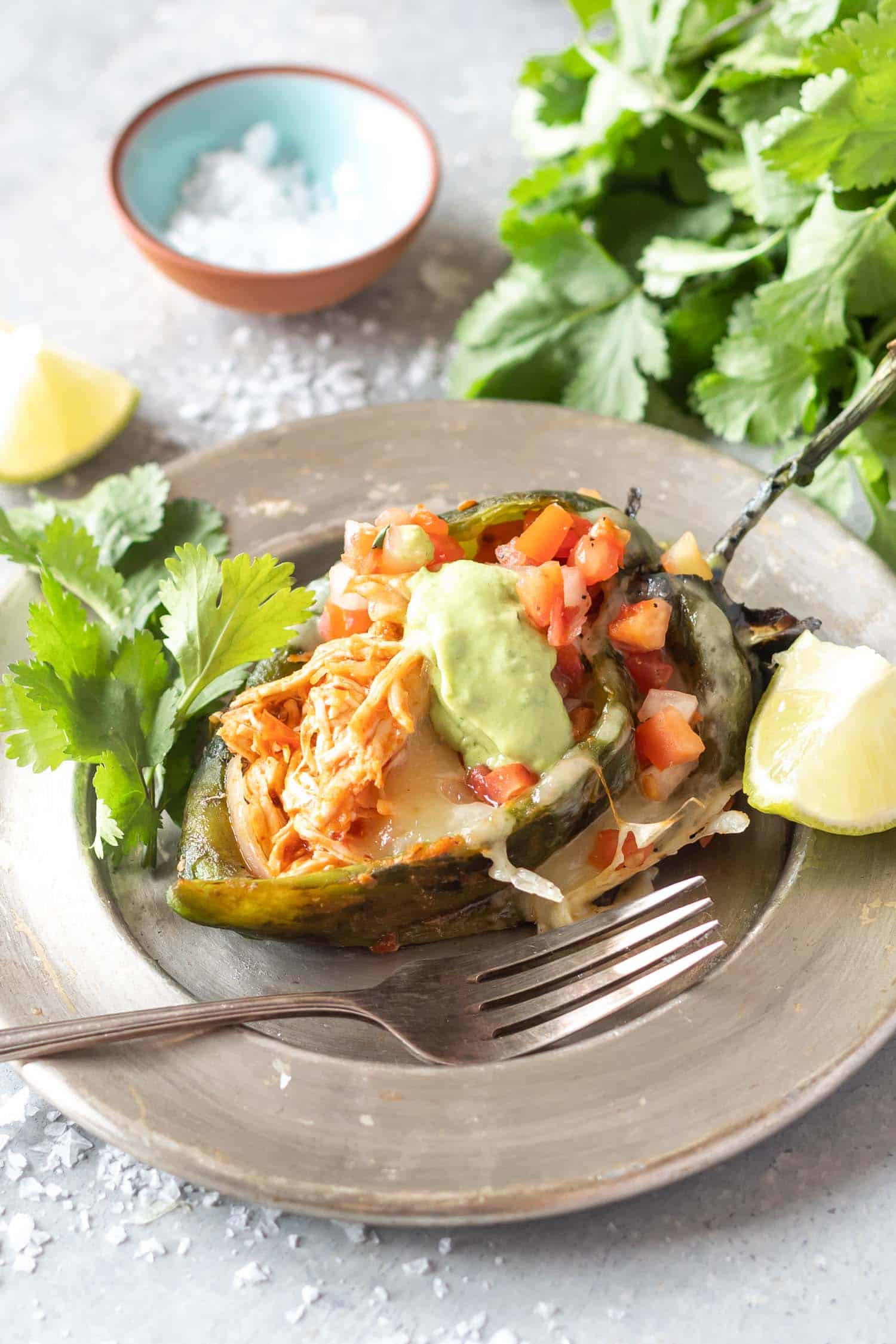 Chicken Stuffed Poblano Peppers on tin plate