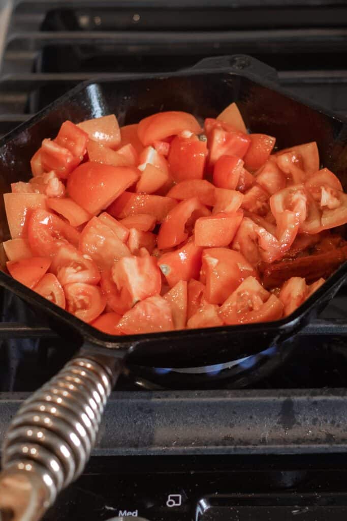chopped tomatoes in skillet