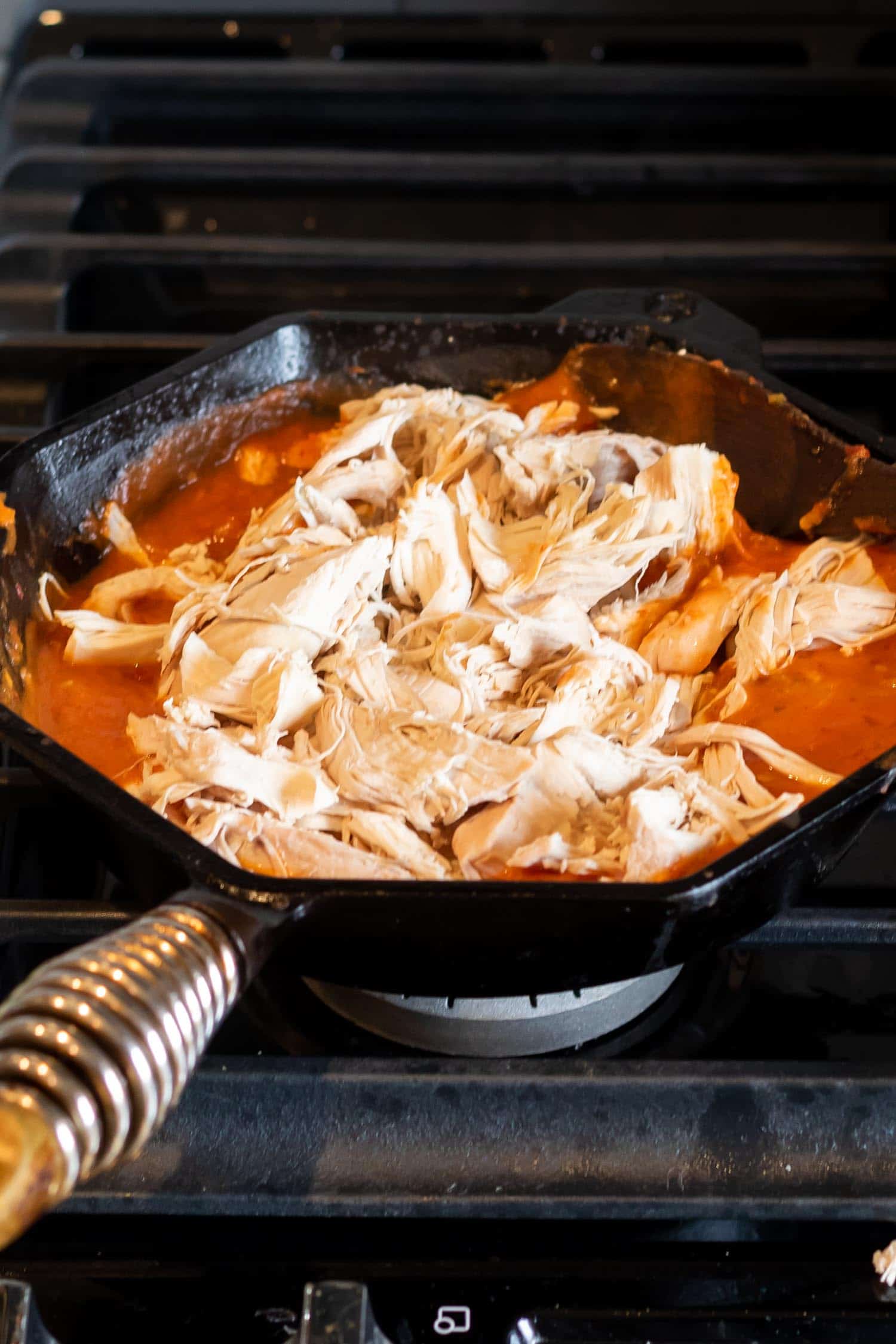 pulled chicken in tinga sauce in skillet