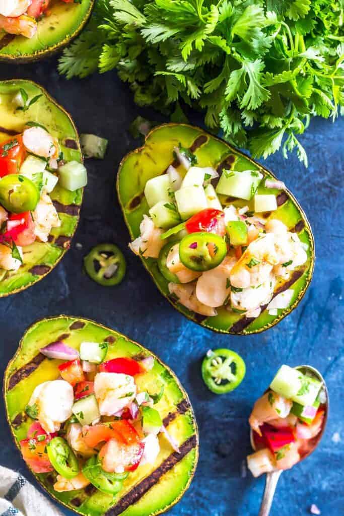 Grilled Shrimp Salsa Stuffed Avocados on a blue background