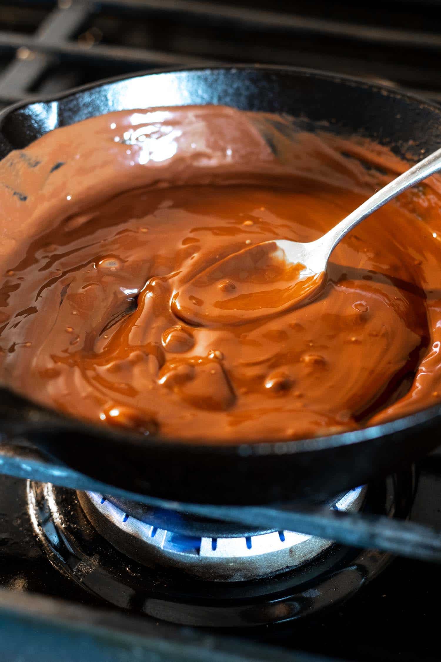 melted chocolate in a cast iron skillet