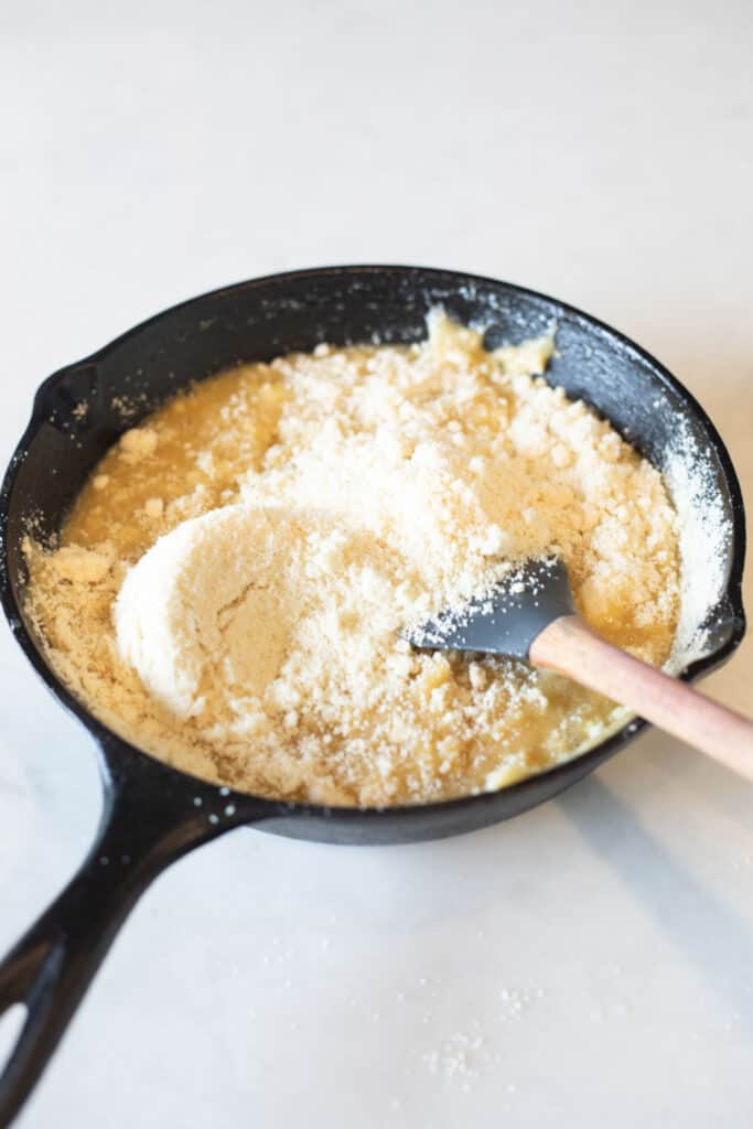 mixing in almond flour to the melted butter