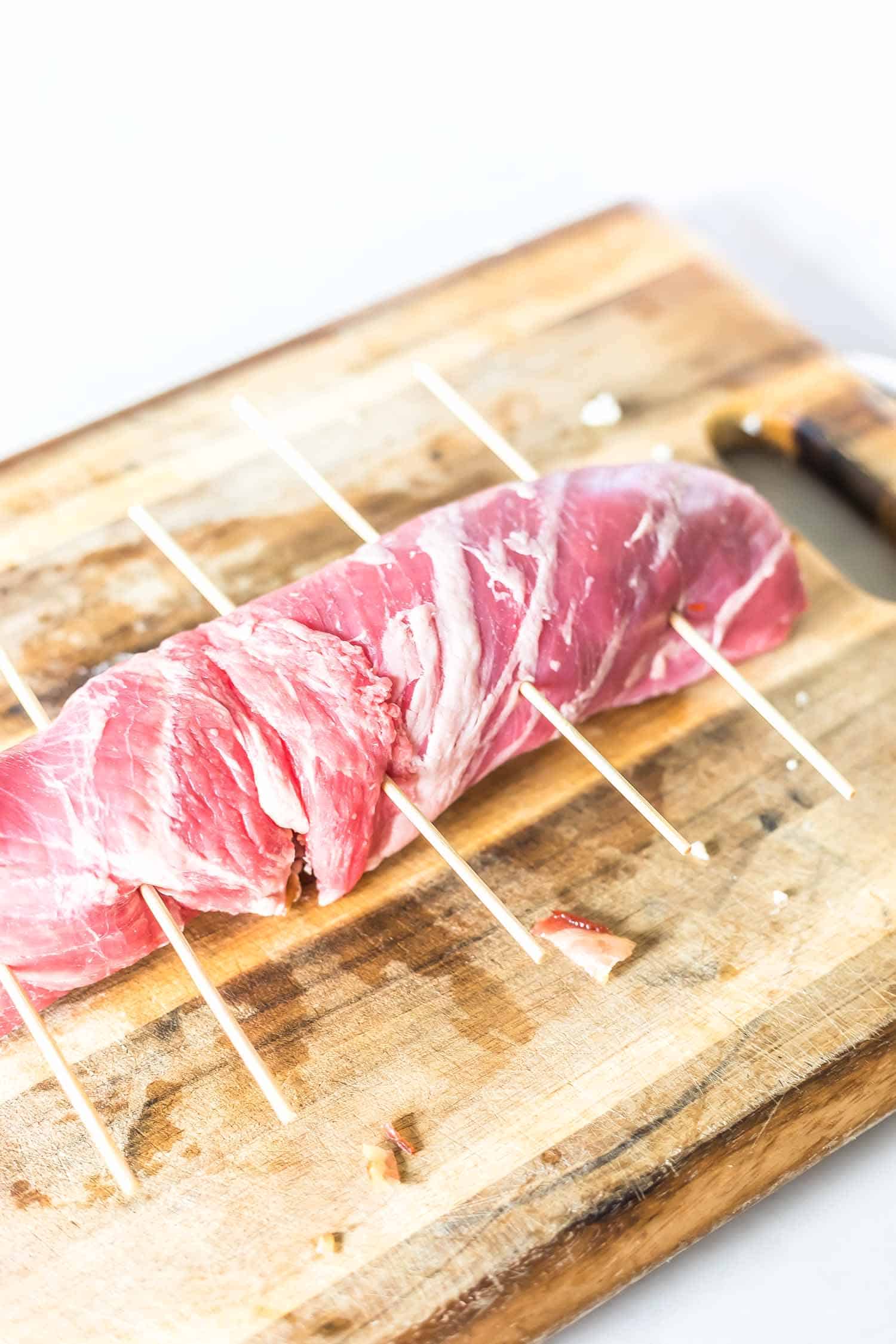 flank steak stuffed with blue cheese, bacon, and caramelized onions rolled up and skewered