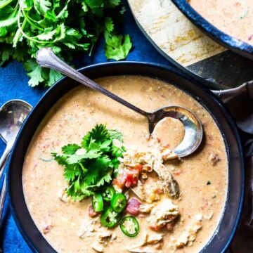 Keto Queso Chicken Soup in bowl topped with cilantro