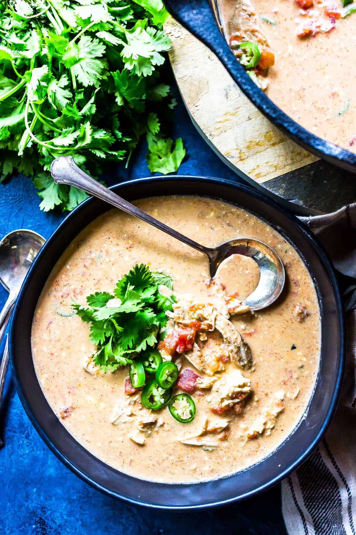 Keto Queso Chicken Soup in bowl topped with cilantro