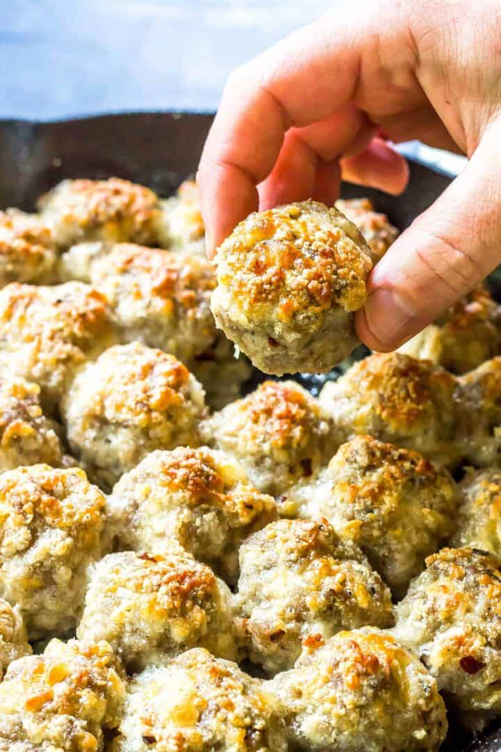 a hand holding Keto Sausage Balls