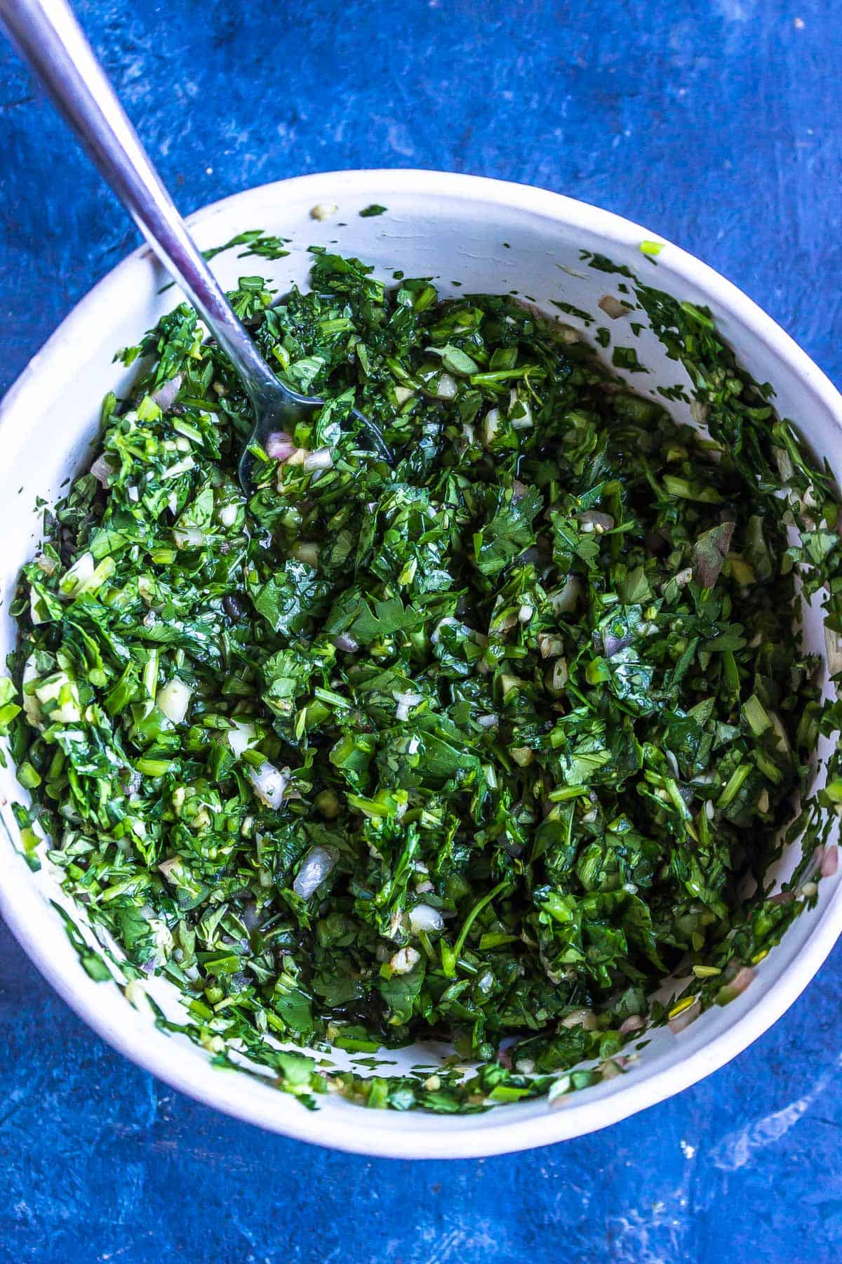 Keto Chimichurri being mixed in a bowl