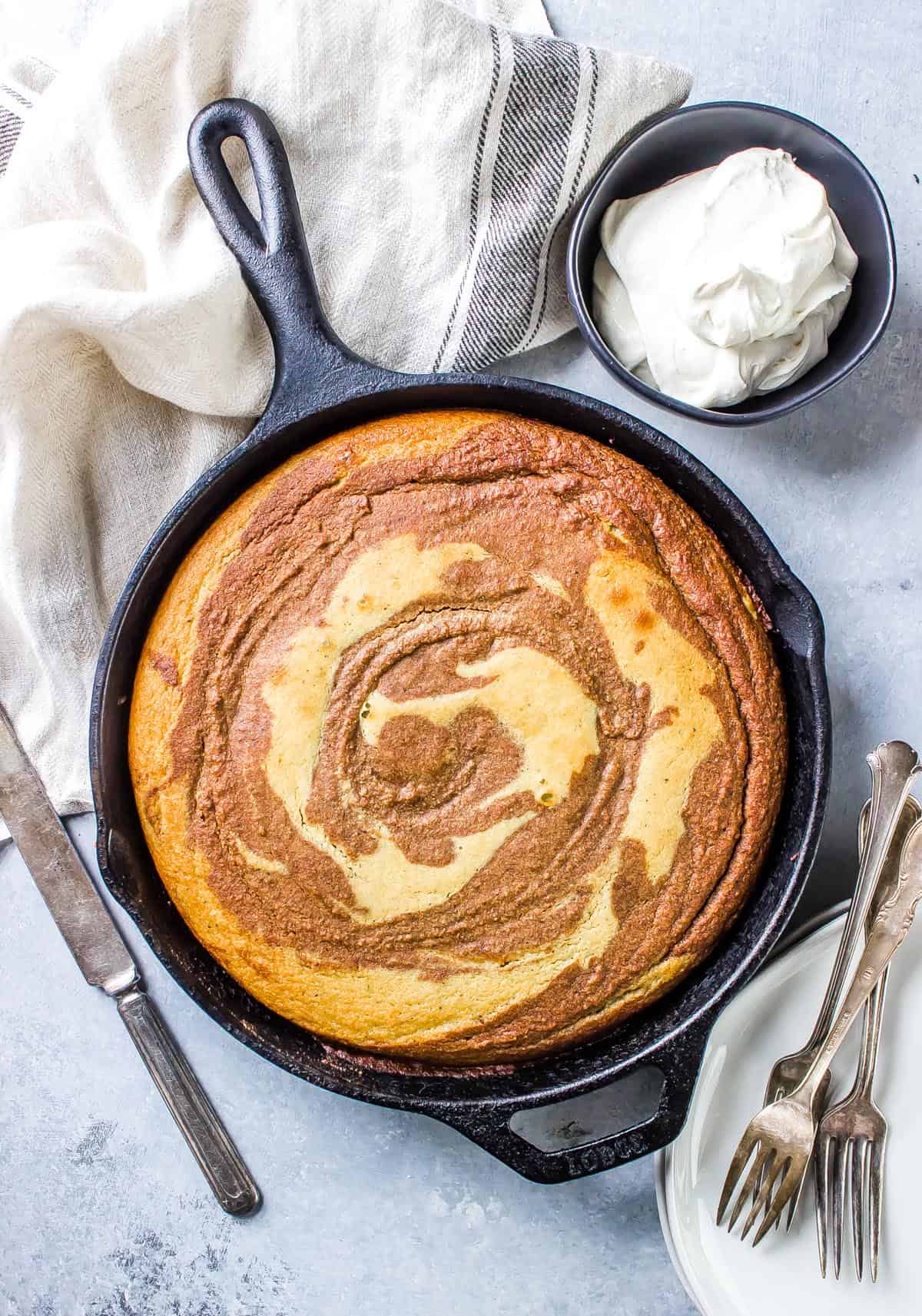 Cake in a cast Iron Skillet before being iced