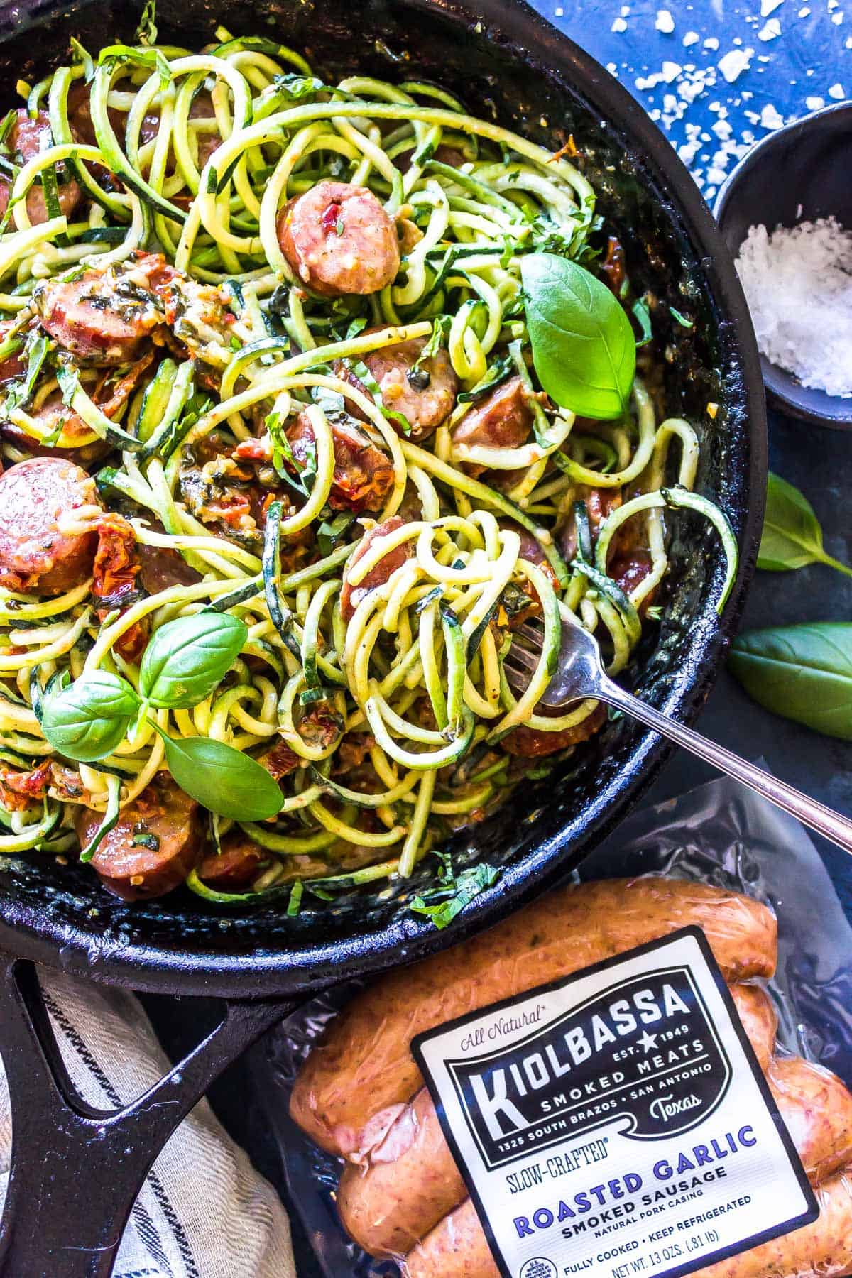 Creamy Tuscan Zoodles with Sausage with kiolbassa packaging in the foreground