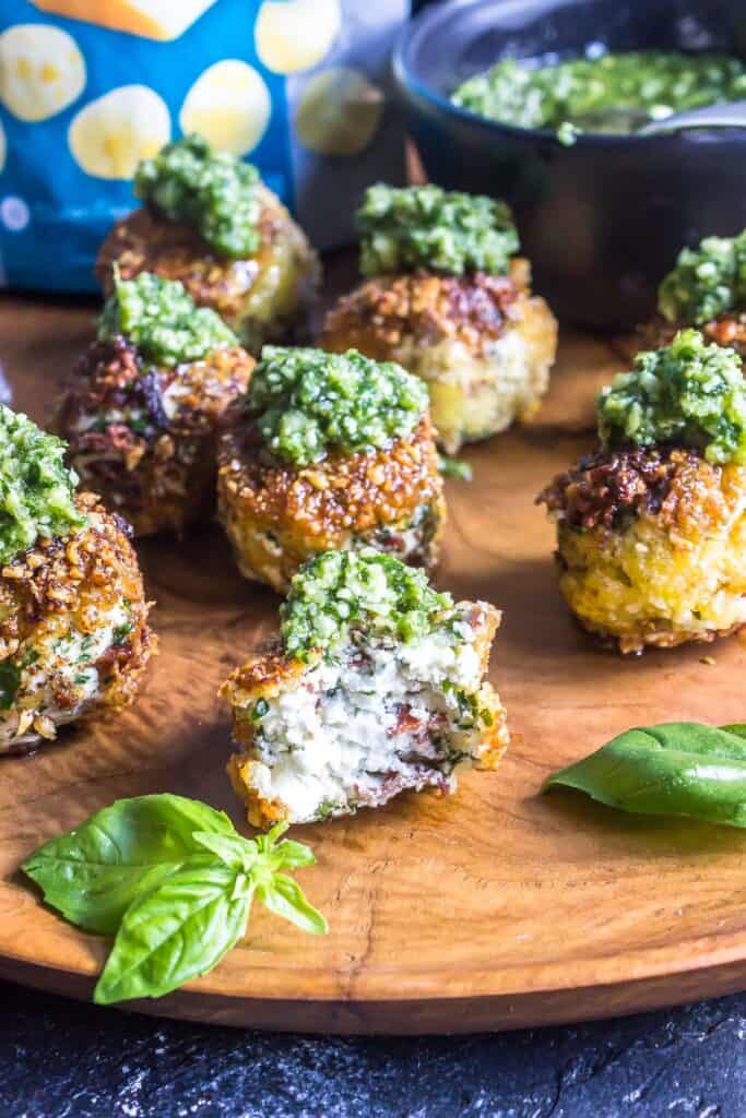 Keto Fried Goat Cheese Poppers with a bite taken out of the front popper
