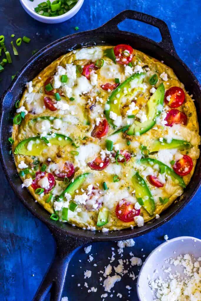 Keto Frittata with Avocado and Queso in a cast iron skillet
