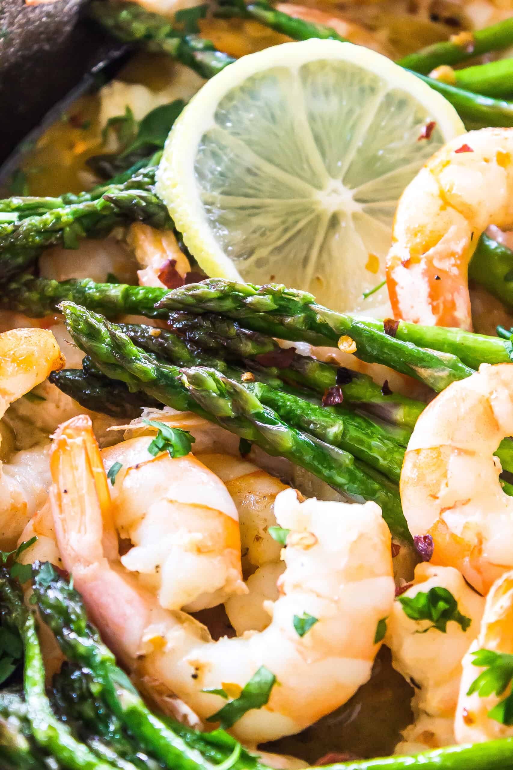 close up od cooked keto garlic butter shrimp and aspargus