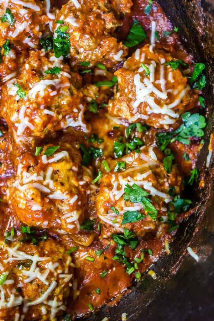 Keto Meatballs in a cast iron dutch oven with marinara sauce