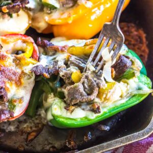Keto Philly Cheese Steak Stuffed Peppers in skillet with fork