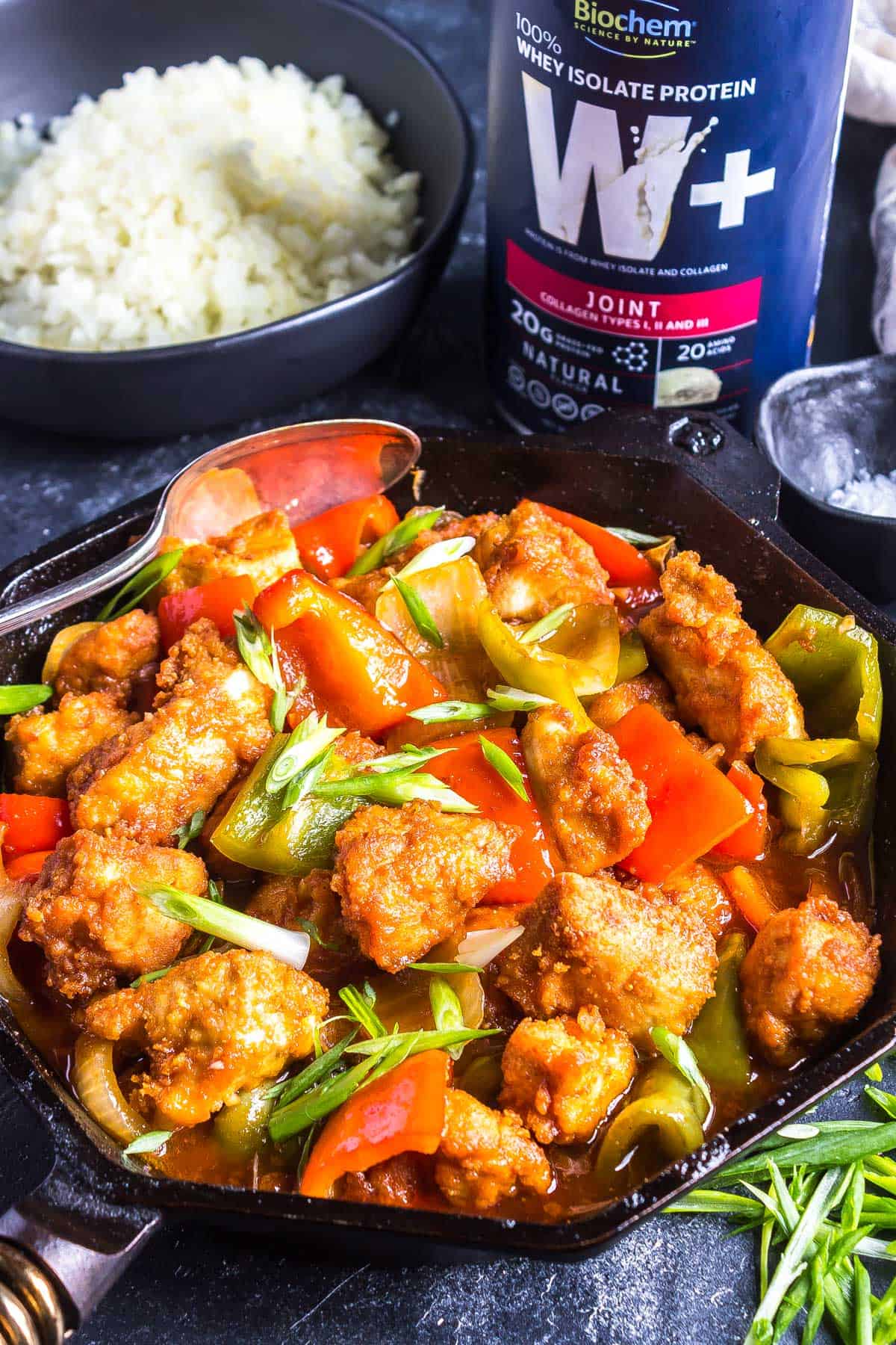 Skillet full of Keto Sweet and Sour Chicken fresh from the stovetop