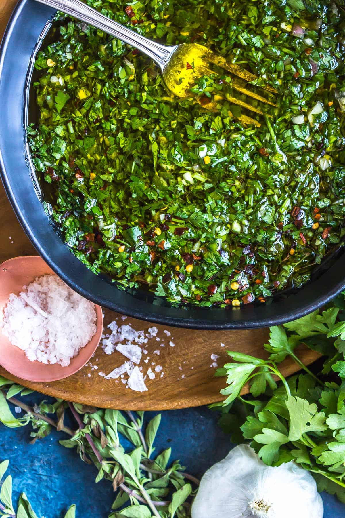 Large Bowl of Keto Chimichurri on a wooden serving platter.