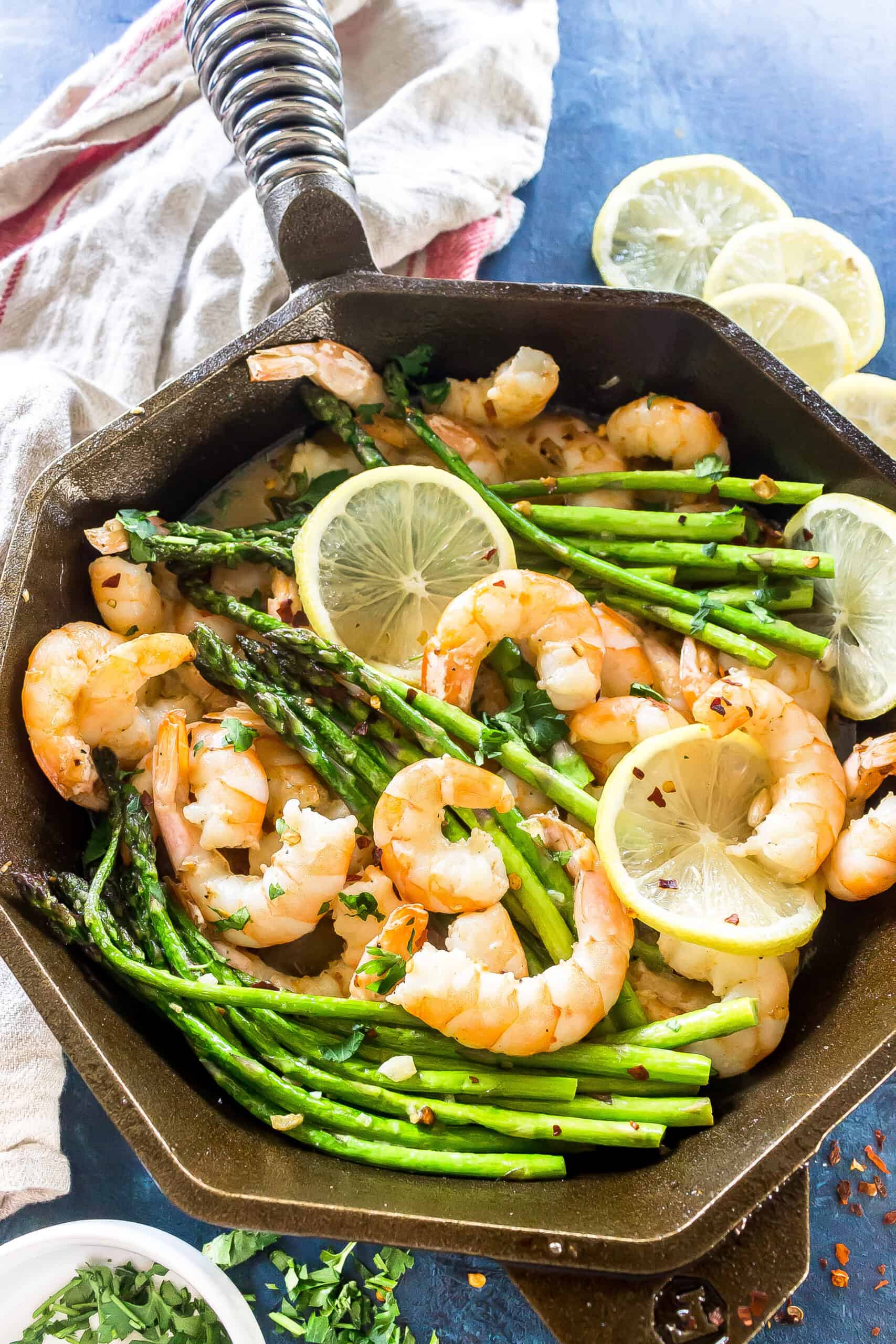 Finished dish: Keto Garlic Butter Shrimp and Asparagus in a cast iron skillet