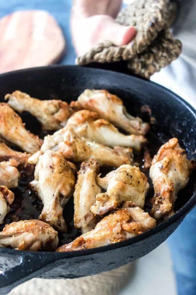 chicken wings in cast iron skillet