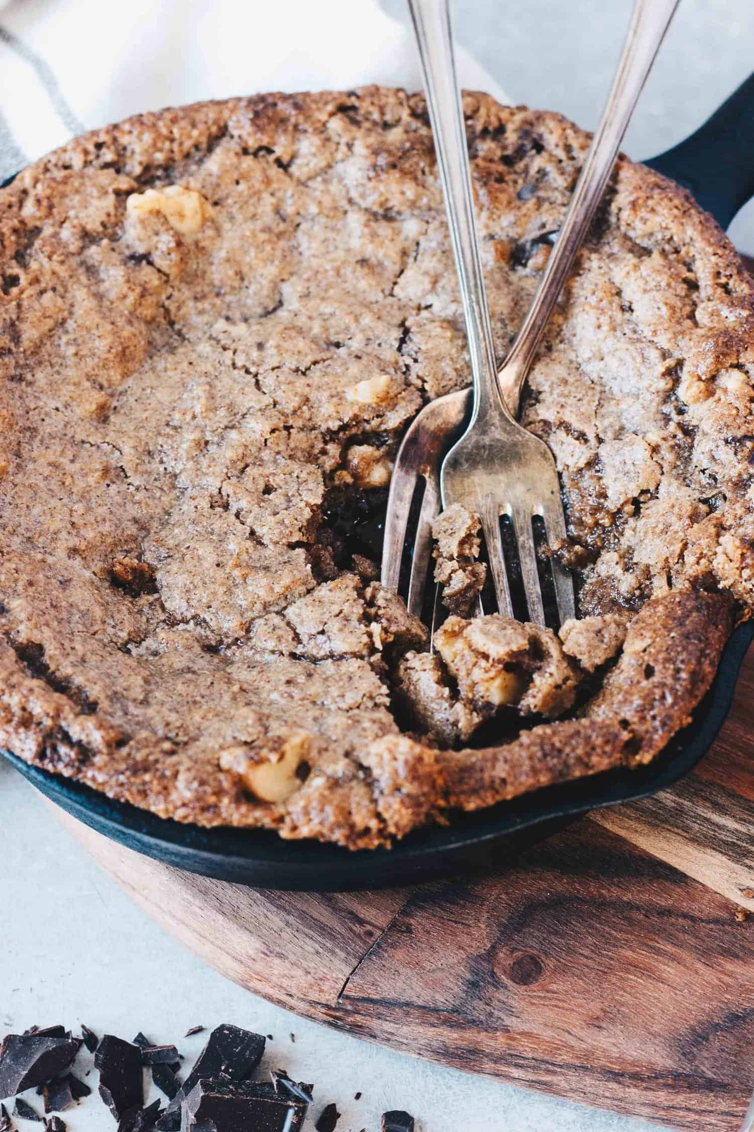 two forks rest in a divot in the White Chocolate Keto Skillet Blondie created from the first bites
