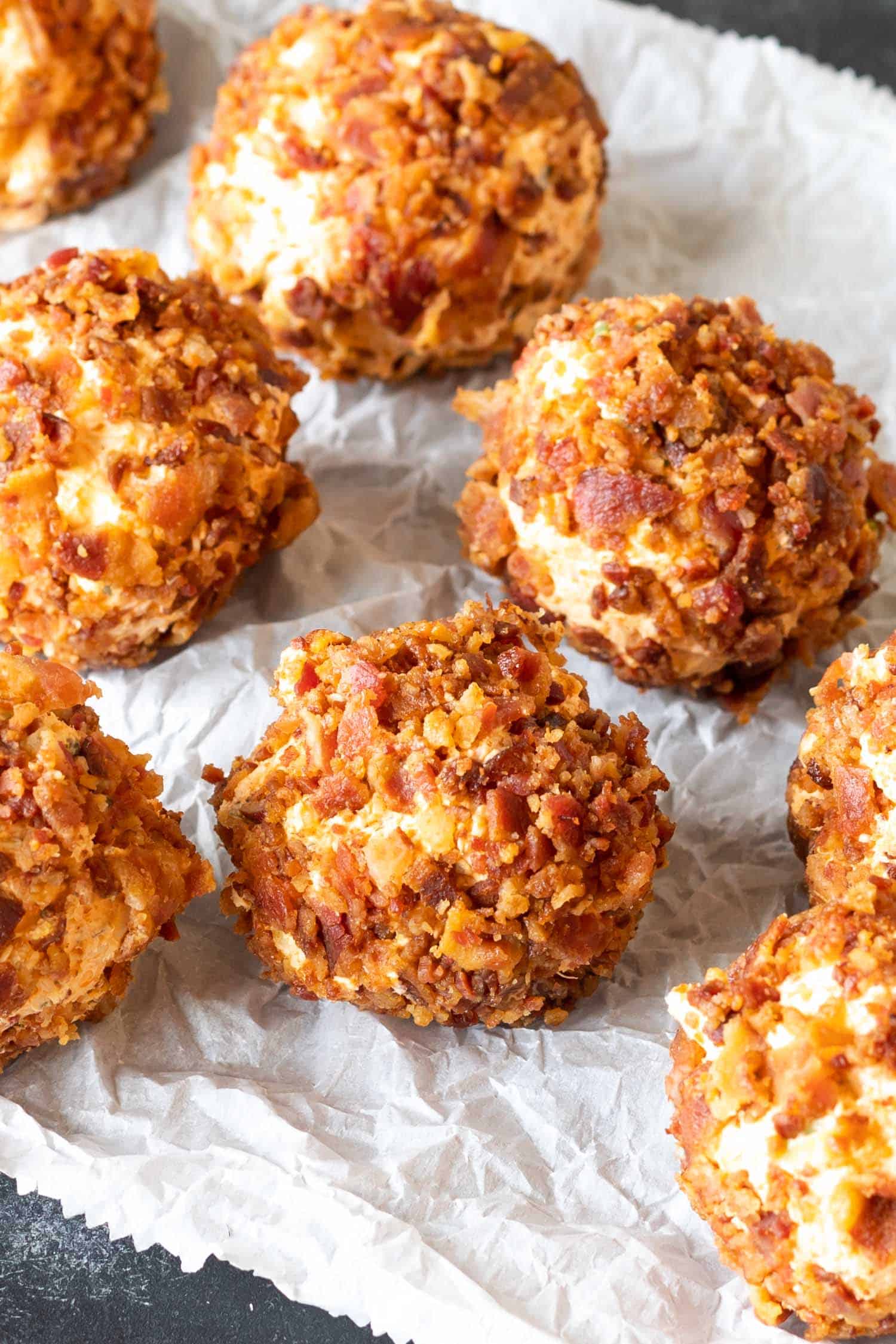 chicken fat bomb mixture formed into balls after rolling in bacon