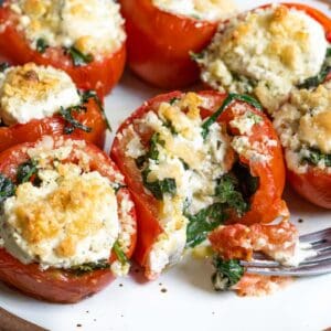 Tomatoes hollowed out and stuffed with wilted spinach, herbed goat cheese, parmesan, and Moon Cheese.