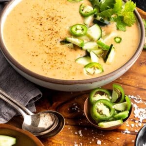 Roasted Vegetable Gazpacho in a bowl topped with cucumber, jalapeno, and cilantro
