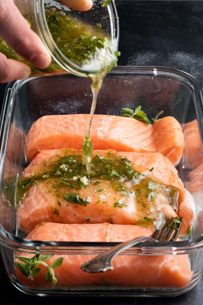 salmon in a glass dish with marinade