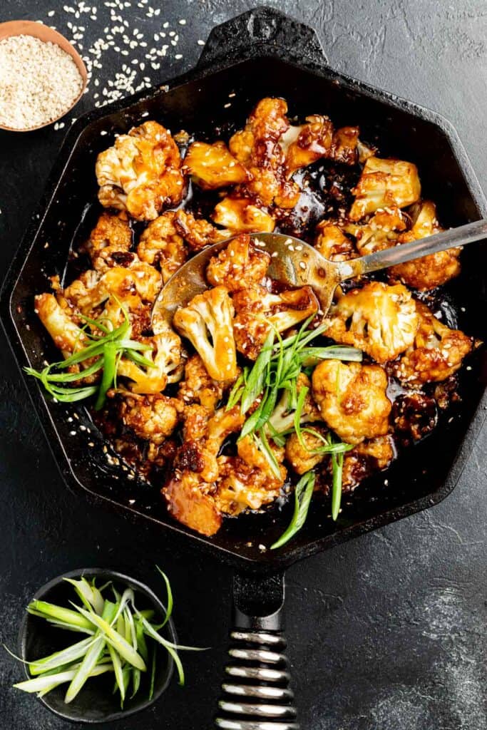 Sticky Sesame Cauliflower in a cast iron skillet