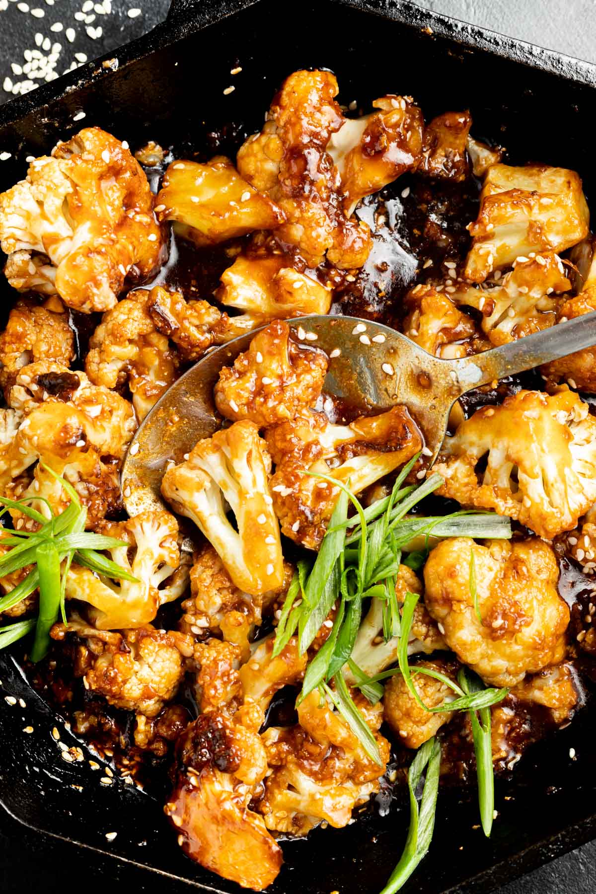 Sticky Sesame Cauliflower in a cast iron skillet