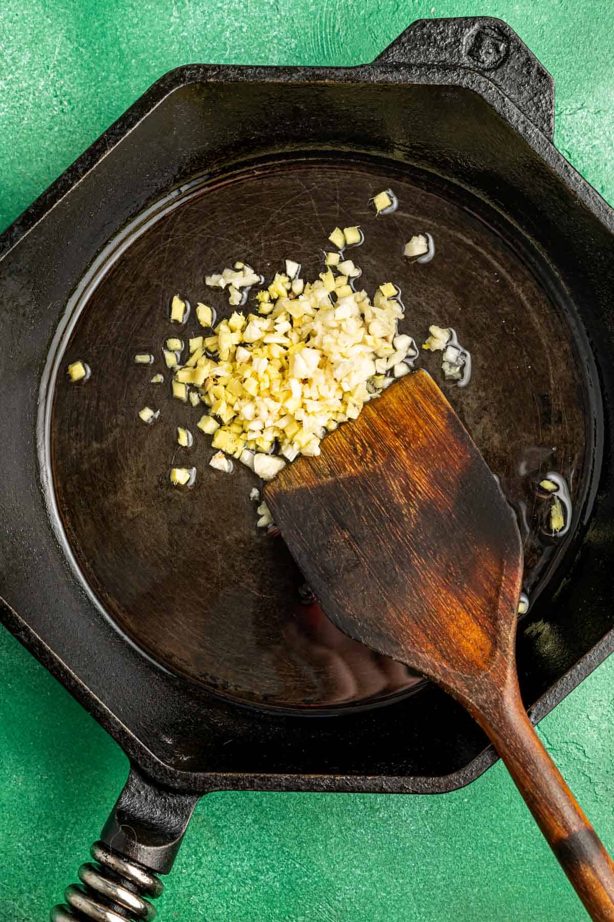 cooking garlic and ginger in a cast iron skillet