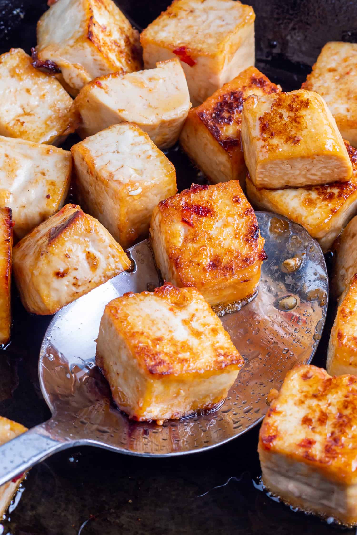 fried tofu in a cast iron skillet