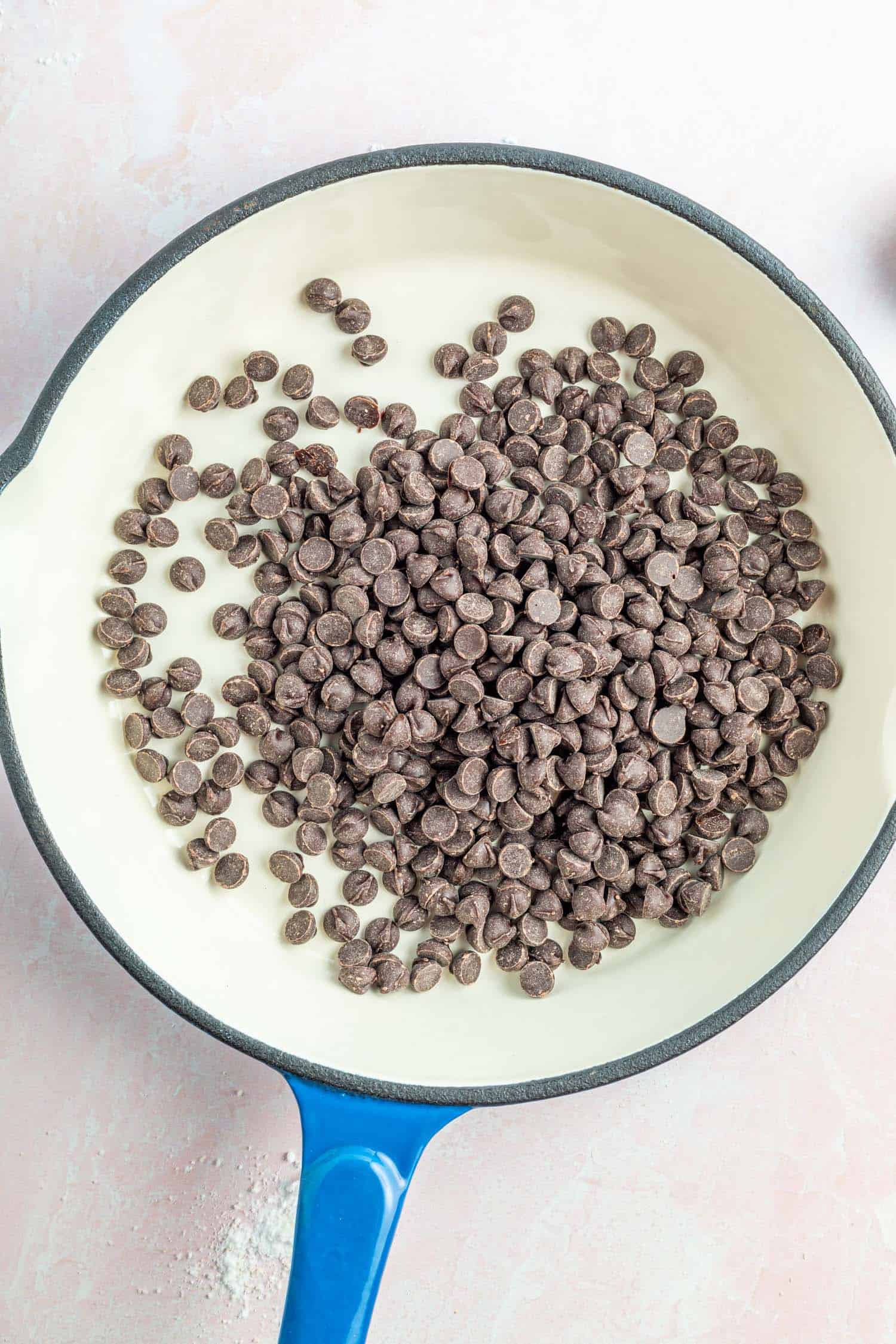 sugar-free chocolate chips in an enameled cast iron skillet