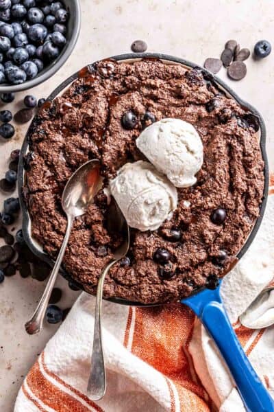 Blueberry Hot Fudge Cake in a blue enameled cast iron skillet