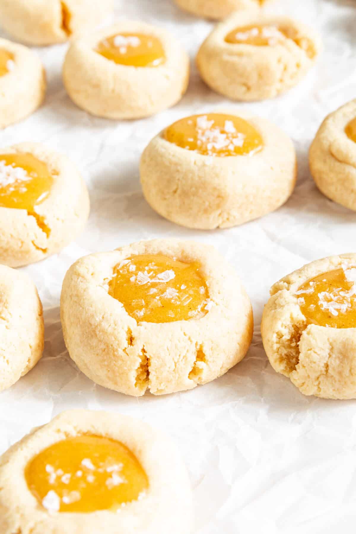 thumbprint cookies on white parchment
