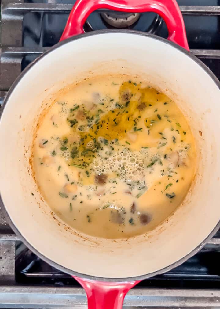 broth and cream being added to the pot