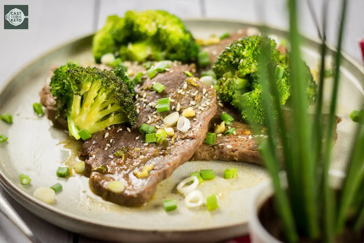 One portion of keto beef and broccoli dish on a plate.