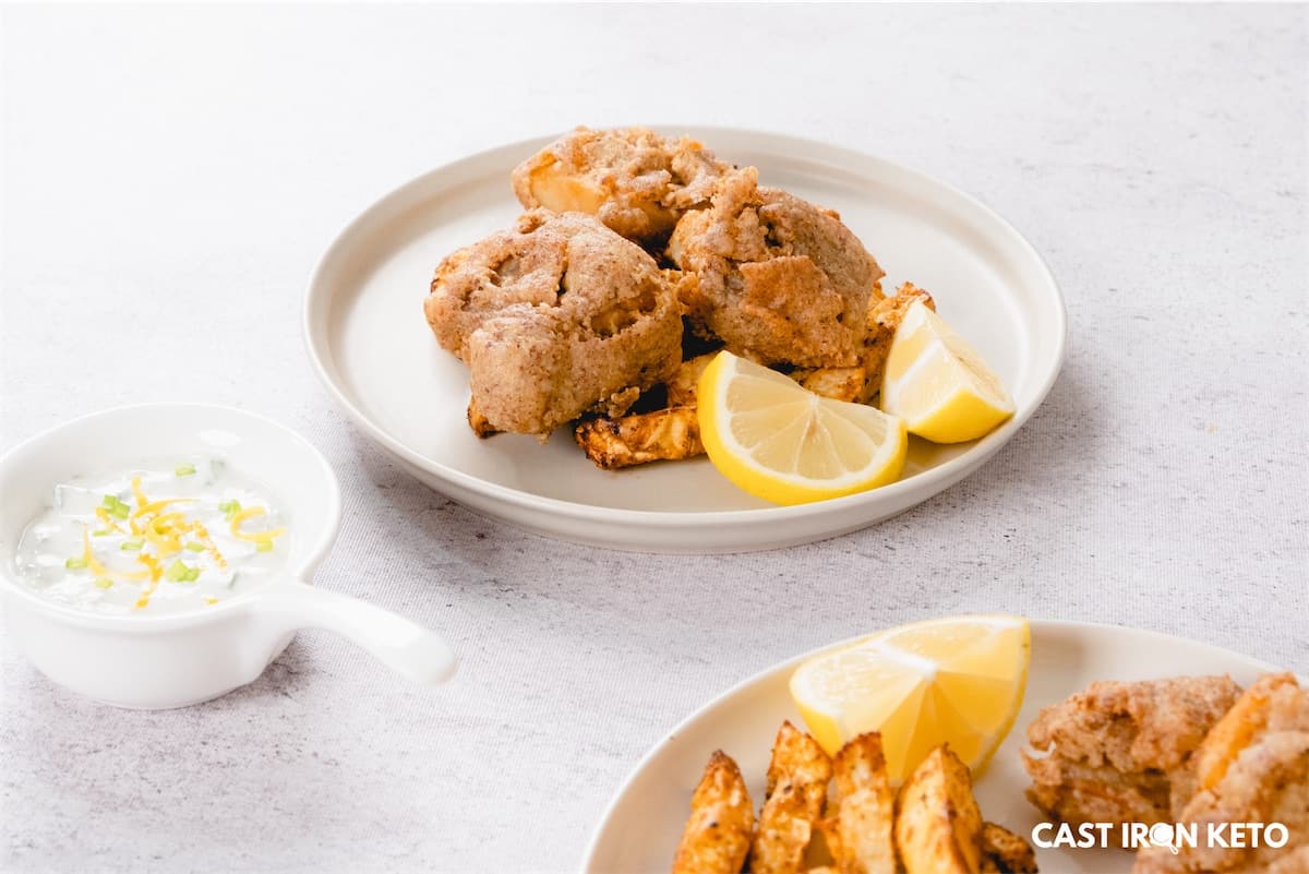 a white plate topped with keto-friendly fish and chip