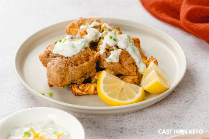 a white plate topped with keto-friendly fish and chips