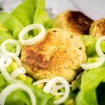 Keto Turkey Burgers Recipe placed on cabbage leaves.