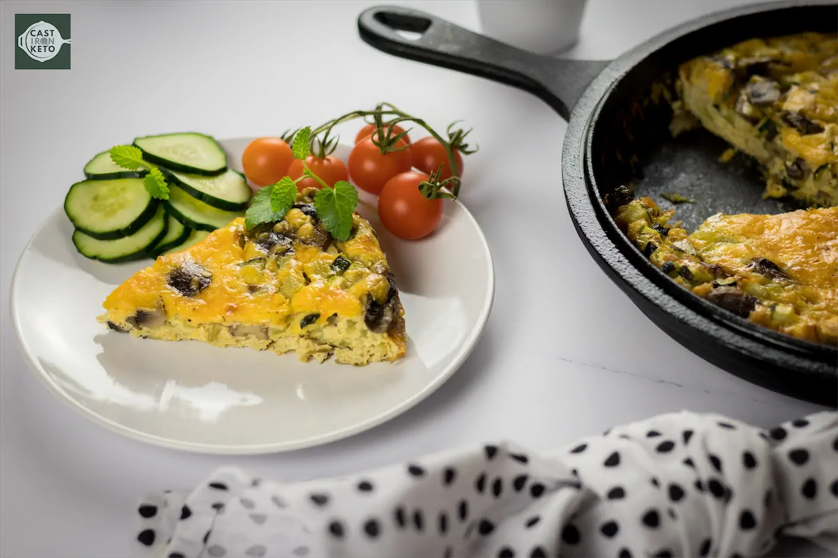 Homemade vegetable frittata served on a kitchen table.