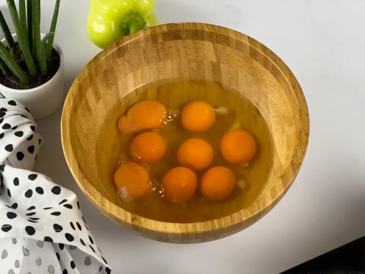 Yolk and egg contents collected on a bowl.