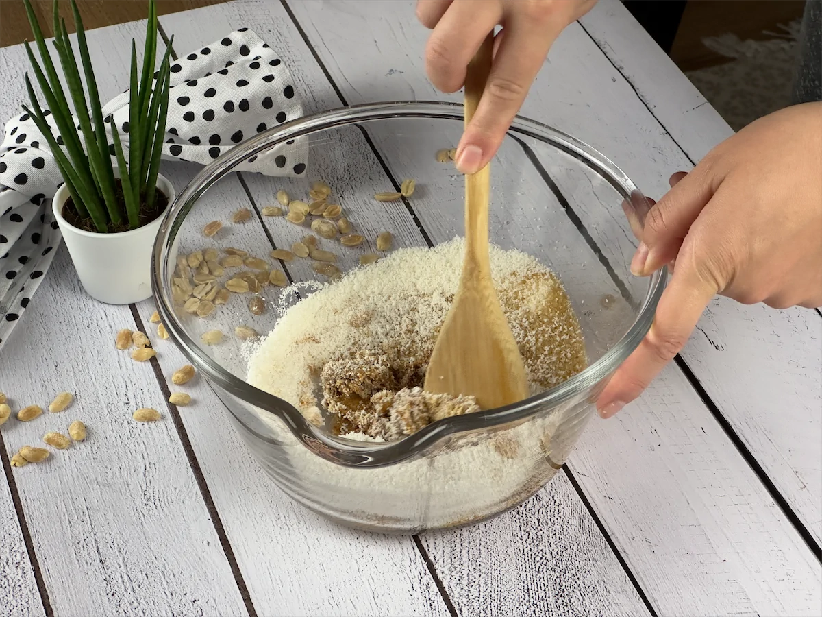Image of a whisk mixing the ingredients in the bowl.