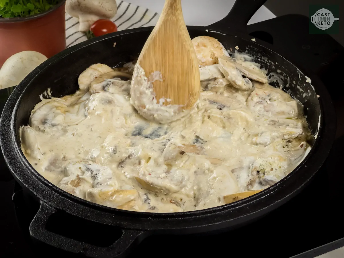 Simmering the creamy mushroom recipe in cast iron pan.